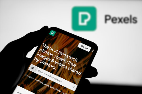 Dhaka, Bangladesh- 29 March 2024: Pexels.com homepage on smartphone and pexels logo on background.