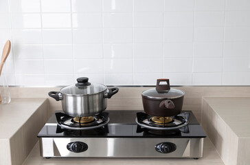A stainless steel pot on a gas stove in kitchen