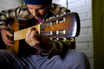 latino man with a guitar