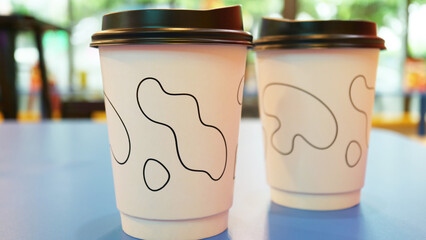 Closeup of disposable takeaway cups of hot drinks