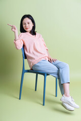 Obraz premium Photo of young Asian woman on background