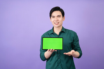 Young Asian business man holding tablet on background