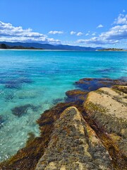 Bay of Fires, Australia Tasmania. Red coastal cliffs on the north east coast of the island of Tasmania.