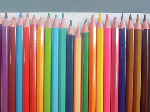 colored pencils of rainbow colors.