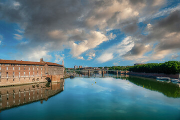 Naklejka premium Toulouse is the capital of the Occitania region in southern France. It is divided by the Garonne River and is located near the border with Spain. It is known as La Ville Rose