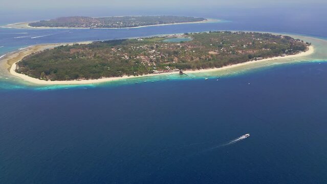 Aerial view of small tropical islands surrounded by coral reef (Gili Islands)