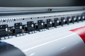Close-up of large format printer heads in action - 770333733
