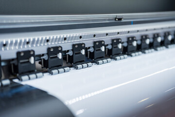 Close-up of large format printer heads in action - obrazy, fototapety, plakaty