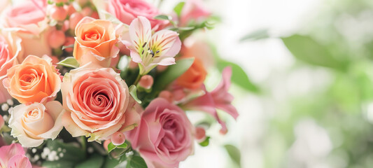 A close-up of a beautifully arranged bouquet with soft-hued roses and lilies.