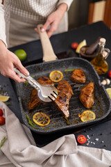 marinated pieces of Organic Tuna Steak frying on a hot grill pan