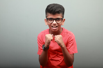 Portrait of a cheering Indian ethnic smart boy 
