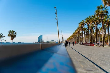 Foto auf Leinwand Promenade mit Joggern am Strand von Barcelona, Spanien © Robert Poorten