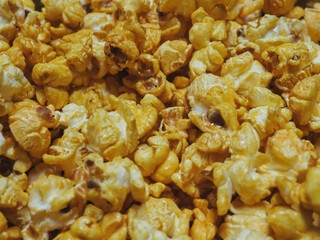 Delicious sweet popcorn, close-up shot for dessert food background. 