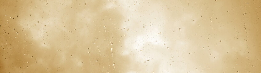 Raindrops, water dripping, rain on a glass pane, rainy weather with clouds, beige and brown texture	 - obrazy, fototapety, plakaty