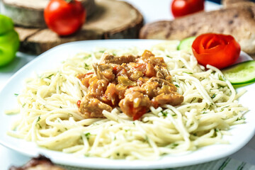 White Plate With Pasta and Meat