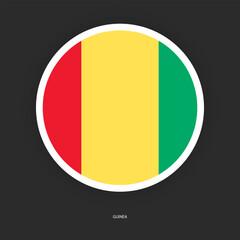 Guinea circle flag icon with white border isolated on dark grey background.