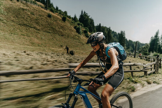 Athletic Woman Conquering Nature on her Electric Bike