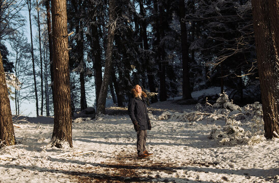 retired man getting some vitamin D in the snowy forest