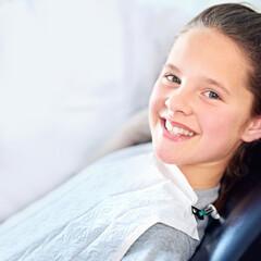 Portrait, girl and dentist chair for mouth exam, hygiene or wellness in consultation room. Face, teeth whitening or happy kid consulting orthodontist for treatment or tooth growth and development