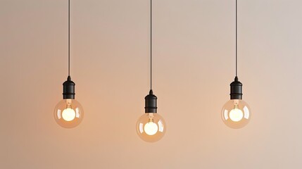 4 hanging LED bulbs hanging on different heights, The bulbs have different sizes ans shapes, background is light beige (almost white) 