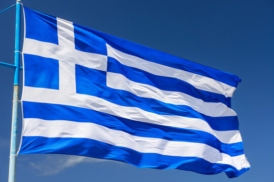 Greece flag over sky background.