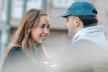 boy and girl couple on the street outdoors talking