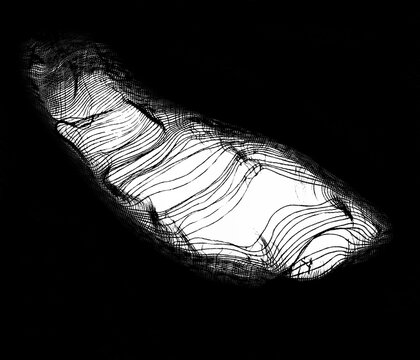 teared rag spread isolated on black background. isolated on black backdrop or any texture. white hole in the tissue. Unbleached beige fabric with torn stitch, hole and loose threads
