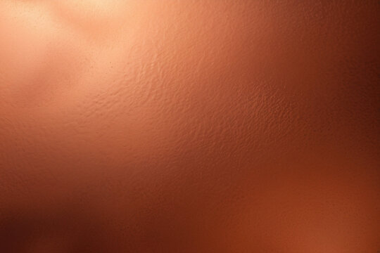A vibrant, close-up image of a textured orange surface, subtly reflecting light for a soft shine effect