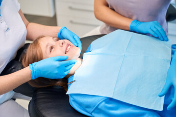 Girl was placed in a chair for dental procedures