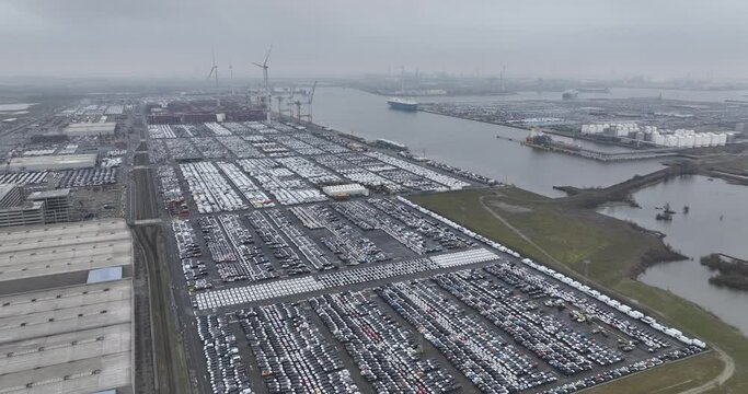Top down aerial drone view on car and other vehicle for over seas shipping terminal in the port of Antwerp, Belgium at the Euroterminal.