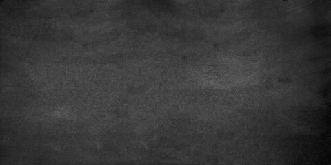 Seamless polished dark concrete floor or old grunge texture, old vintage charcoal black chalkboard or blackboard, Dark wallpaper grunge texture copy space, Texture of a grungy black concrete.