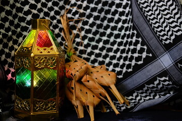 stained glass lamps and ketupat against the background of keffiyeh cloth