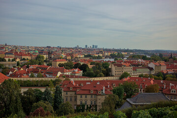 Fototapeta na wymiar Panoramic view of the city of Prague from the observation deck. Streets and architecture of the old city. Romantic panorama of the city. Amazing nature, exquisite architecture and bustling life.