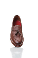 Isolated One Traditional Formal Stylish Brown Pebble Grain Tassel Loafer Shoe Against White Surface. - 770483943