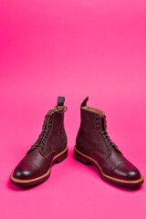 View of Dark Brown Grain Brogue Derby Boots Made of Calf Leather with Rubber Sole Placed Over Pink Burgundy - 770485359