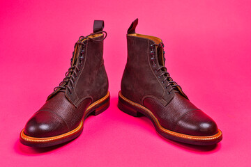 View of Dark Brown Grain Brogue Derby Boots Made of Calf Leather with Rubber Sole Placed Over Pink Burgundy - 770485364