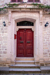 Fototapeta na wymiar Old wooden door in the old town of Cunda, Turkey