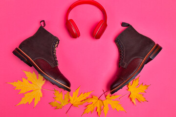 View of Premium Dark Brown Grain Brogue Derby Boots Made of Calf Leather with Rubber Sole Placed With Maple Leaves and Headphones - 770485740