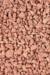 Construction Materials Ideas. Closeup Image of Background Made of Pile of Colorful red and Brown Crushed Stone