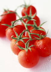 Red fresh tomatoes on white background