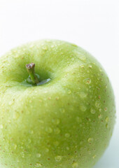 Fresh green apple with drops