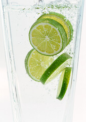 Sliced limes in clear water