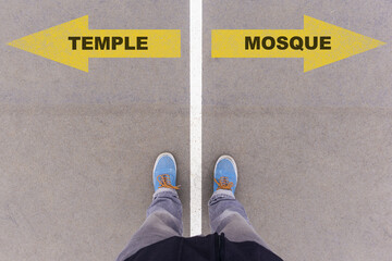 Temple or Mosque choice, text on asphalt ground, feet and shoes on floor