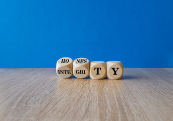 Honesty and integrity symbol. Turned wooden cubes and changes the word integrity to honesty....