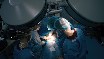 A group of professional surgeons in the operating room. Close-up of a surgical operation. Plastic...