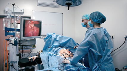 Surgeons use an endoscope during laparoscopy surgery. Concept of surgery, health and modern medical...