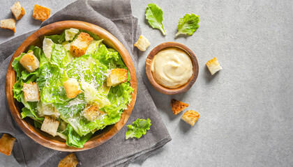 Caesar Salad. A bowl of Caesar Salad with croutons and cheese and vegetables. copy space - obrazy, fototapety, plakaty