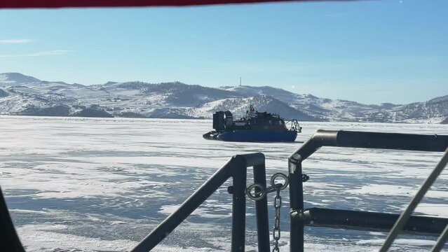 Hovercraft on the frozen lake Baikal, winter lake Baikal, transport rides on the frozen lake