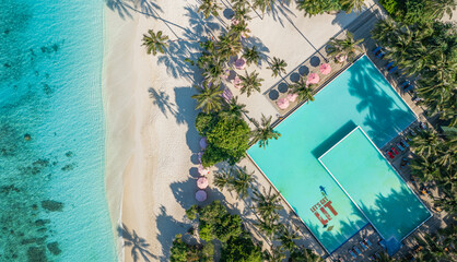 Nice tranquil Maldives island, luxury swimming pool resort aerial view. Beautiful sunny pristine sea bay beach background. Summer vacation holiday. Paradise shore palm tree shadow exotic landscape