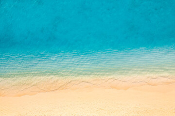 Relaxing aerial beach scene, summer vacation holiday landscape. Waves splash surf with amazing blue...